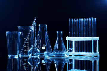 Test tubes and flasks on dark background