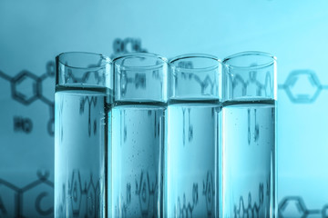 Test tubes on colour background