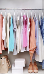 Collection of clothes hanging on a rack