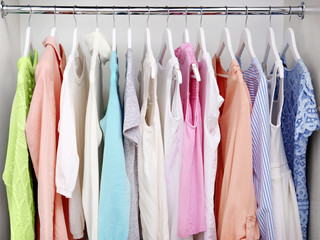 Collection of clothes hanging on a rack