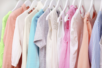 Collection of clothes hanging on a rack