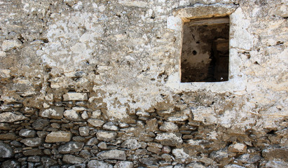 Old  wall with a window hole