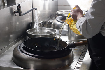 Close up of working chef preparing chinese food