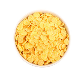 Bowl with cornflakes on white background