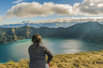 Fototapeta na wymiar Young Woman Watching the View at Quilotoa Lake