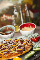 Delicious pizza served on wooden table