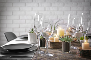 Table served with succulents for dinner in living room