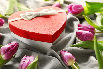 Heart shaped  gift box with tulips, closeup