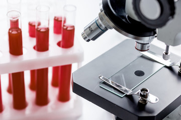 close up macro microscope with blood sample on white background