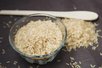 Plate and wooden spoon with white rice