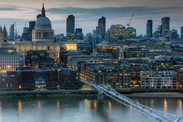 Naklejka premium LONDON, ENGLAND - JUNE 18 2016: Night photo of Millennium Bridge, Thames River and St. Paul Cathedral, London, Great Britain
