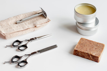 white desktop with tools for shaving beards