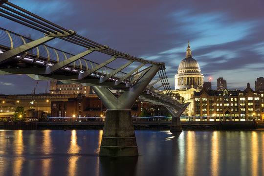 LONDON, ENGLAND - JUNE 18 2016: Night photo of Millennium Bridge, Thames River and  St. Paul Cathedral, London, Great Britain