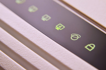 Closeup of internet router LED lights showing connection status. Emitting diode wireless on white...
