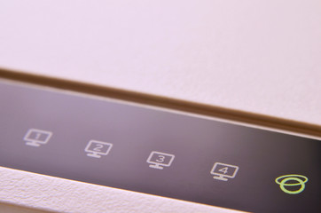 Closeup of internet router LED lights showing connection status. Emitting diode wireless on white...