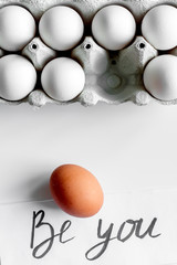 concept of correct choice eggs on white background top view