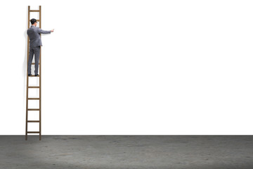 Businessman climbing stairs isolated on white