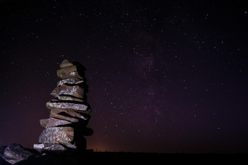 Cairn under a starry sky on Sliabh Mis Mountains, County Kerry, Ireland