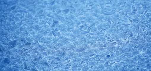 frost crystal on window glass in winter season