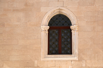 Fototapeta na wymiar Historic window on a building in Dubrovnik, Croatia. Dubrovnik is popular tourist destination and UNESCO World Heritage Site. 