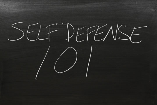 The words "Self Defense 101" on a blackboard in chalk