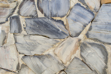 Decorative slate stone wall texture.Stone Cladding wall background.