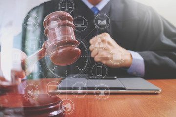 justice and law concept.Male judge in a courtroom striking the g