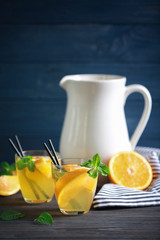 Two glasses with fresh lemonade on table