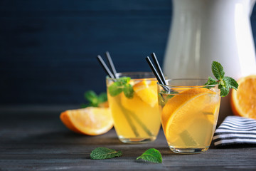 Two glasses with fresh lemonade on table