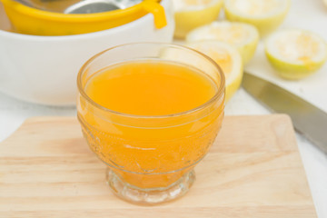 passion fruit and Juice in glass on wood table