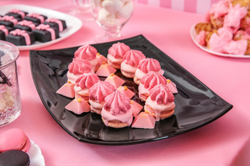 Obraz na płótnie Canvas Table with tasty sweets prepared for party, closeup