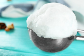 Ice cream scoop with snowball on blurred background, closeup