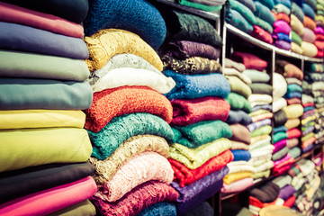 Fabric lines the walls of this tailor in Vietnam