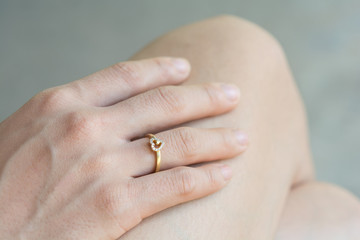 heart-shaped ring on a finger
