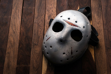 Halloween mask on the teak wood background.