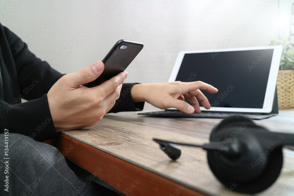 Aufkleber  man hand using VOIP headset with digital tablet computer dockin