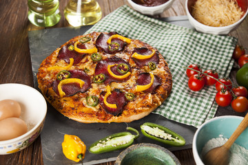 Delicious pizza served on wooden table