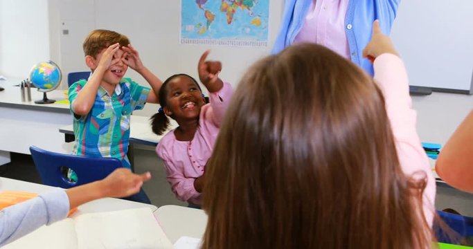 School kids irritating teacher in classroom at school 4k
