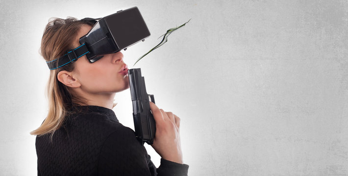 Woman play VR shooter game with virtual reality gun and vr glass