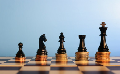 Chess pieces on stacked coins,