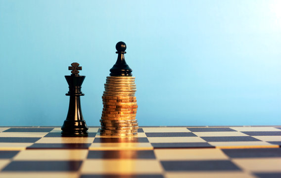 Chess Pieces On Stacked Coins