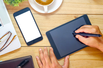 Mock up Blank screen tablet and smartphone, Office desk table with computer, supplies and coffee cup