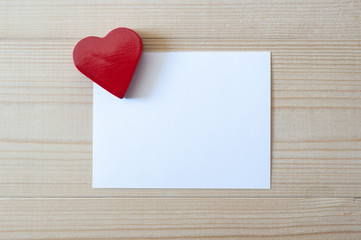Red heart with white card. Love and Valentines concept.