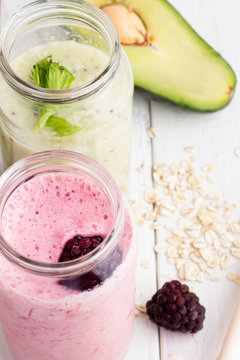 pink and green smoothie on a white background