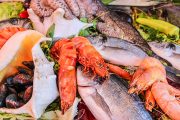Shrimp, fish, mussels and lobsters on ice