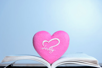 pink heart on book
