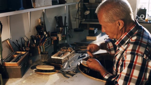 Close-up of goldsmith working in workshop 4k