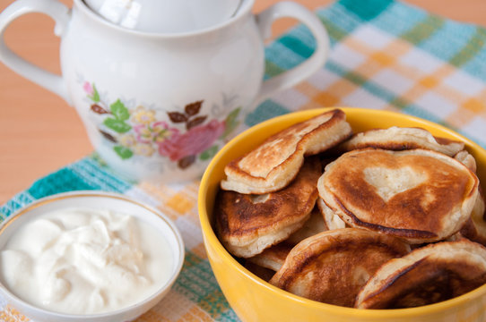 Delicious pancakes with sour cream for breakfast