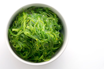 Hiyashi Wakame Chuka or seaweed salad in bowl on white background , Japanese food © Phawat
