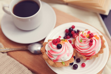 breakfast with coffe and tasty cakes in bed